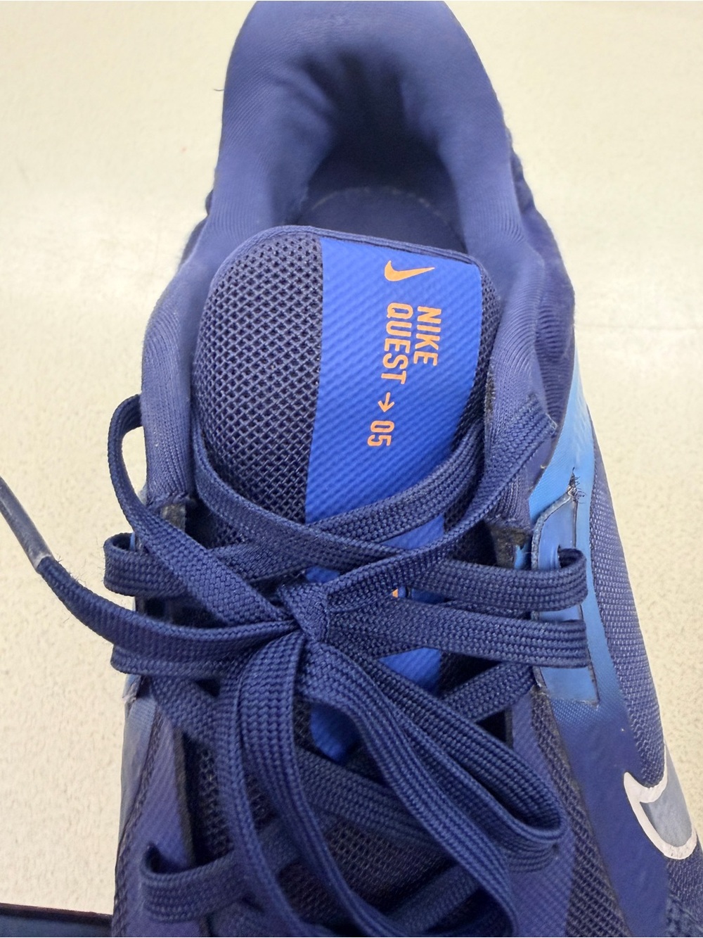Nike Quest 05 Men's Sneaker in Navy and Blue with Orange Accent